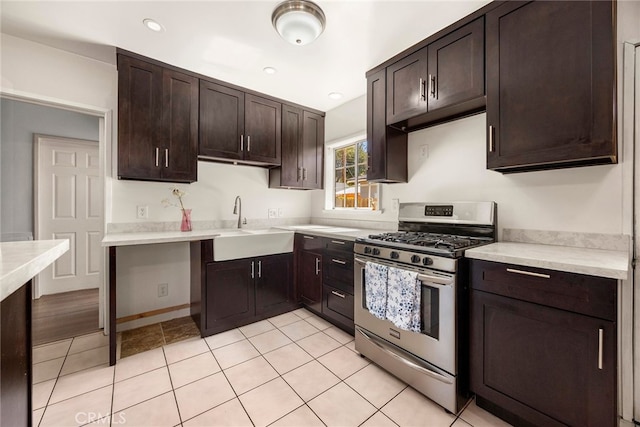 2051 Royal Oaks Dr, Duarte, CA 91010 - kitchen featuring stainless steel gas stove, dark brown cabinetry, light countertops, light tile patterned floors, and recessed lighting