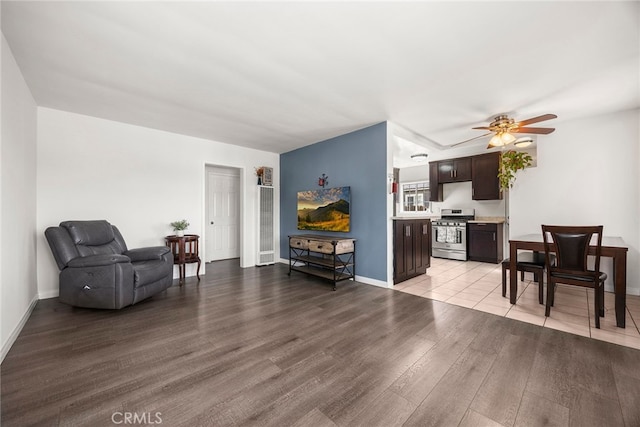 2051 Royal Oaks Dr, Duarte, CA 91010 - living room with light wood finished floors and ceiling fan