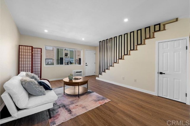 1157 Emerald Ave, El Cajon, CA 92020 - sitting room with wood finished floors, stairs, recessed lighting, and a wall mounted air conditioner