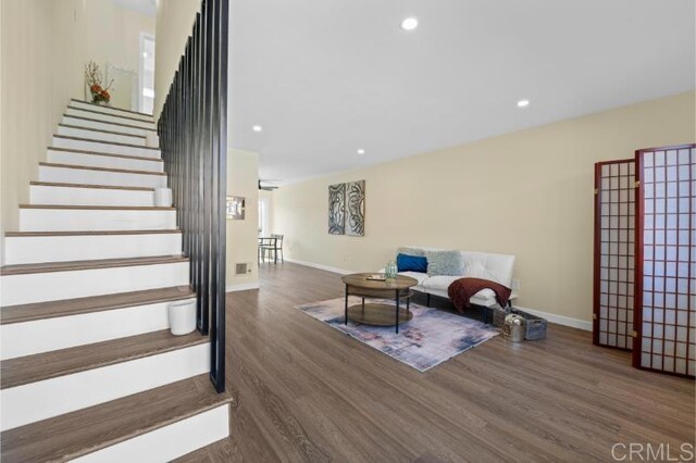 1157 Emerald Ave, El Cajon, CA 92020 - staircase with wood finished floors and recessed lighting
