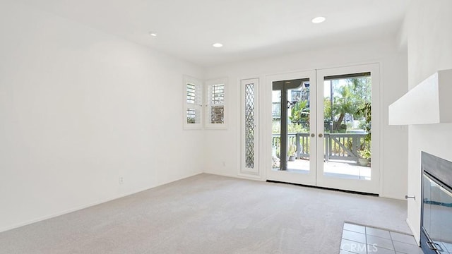 54 Lobelia, Rancho Santa Margarita, CA 92688 - unfurnished living room with light colored carpet, healthy amount of natural light, recessed lighting, and a fireplace with flush hearth