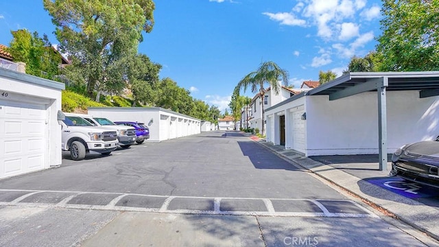 54 Lobelia, Rancho Santa Margarita, CA 92688 - view of car parking featuring community garages and a residential view
