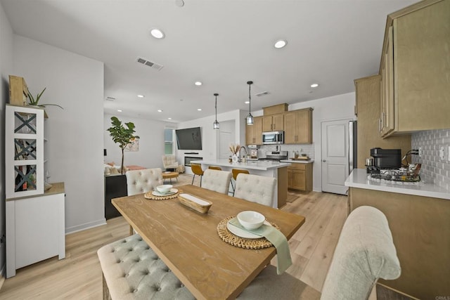 32755 Brunello Way, Temecula, CA 92591 - dining space with light wood-type flooring and recessed lighting