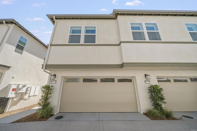 32755 Brunello Way, Temecula, CA 92591 - view of front of home with a garage, stucco siding, and concrete driveway
