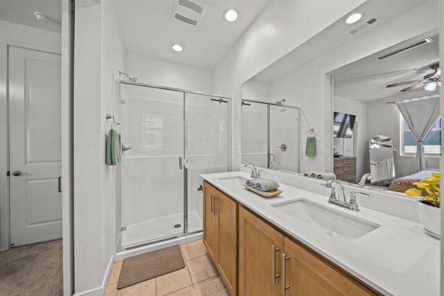 32755 Brunello Way, Temecula, CA 92591 - full bath with connected bathroom, double vanity, ceiling fan, a shower stall, and tile patterned flooring