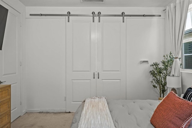 32755 Brunello Way, Temecula, CA 92591 - bedroom featuring light colored carpet, a closet, and a barn door