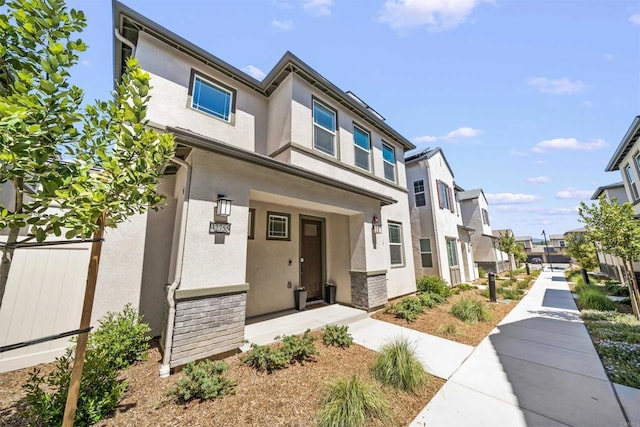 32755 Brunello Way, Temecula, CA 92591 - view of front facade with a residential view, stucco siding, and stone siding