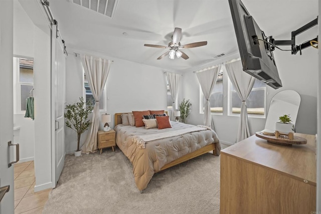 32755 Brunello Way, Temecula, CA 92591 - bedroom with a ceiling fan, light tile patterned floors, and light colored carpet