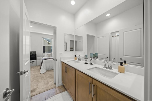 32755 Brunello Way, Temecula, CA 92591 - ensuite bathroom featuring double vanity, tile patterned flooring, and recessed lighting