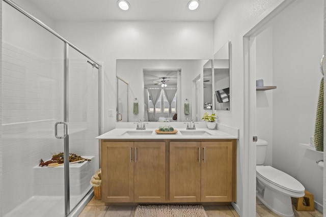 32755 Brunello Way, Temecula, CA 92591 - bathroom with ceiling fan, a shower stall, double vanity, recessed lighting, and tile patterned floors