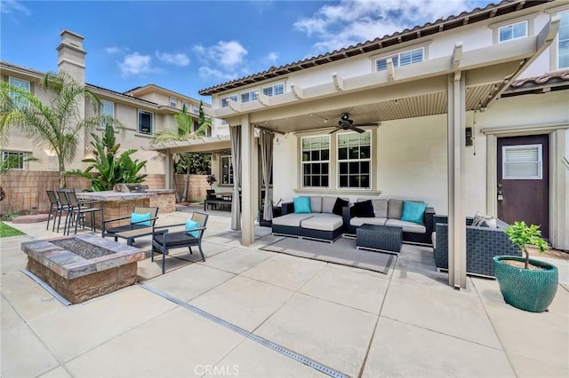 46379 Canyon Crest Ct, Temecula, CA 92592 - view of patio / terrace with an outdoor hangout area, an outdoor kitchen, a ceiling fan, and a bar