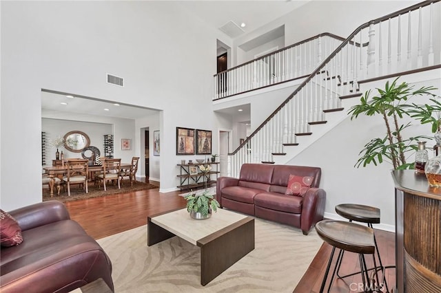 46379 Canyon Crest Ct, Temecula, CA 92592 - living room with a high ceiling, wood finished floors, and stairway