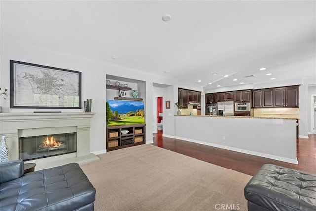 46379 Canyon Crest Ct, Temecula, CA 92592 - living room featuring recessed lighting, wood finished floors, and a glass covered fireplace