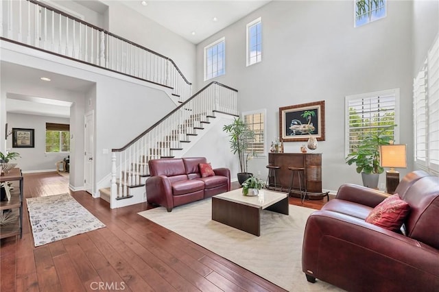46379 Canyon Crest Ct, Temecula, CA 92592 - living room featuring a towering ceiling, hardwood / wood-style floors, stairs, and recessed lighting