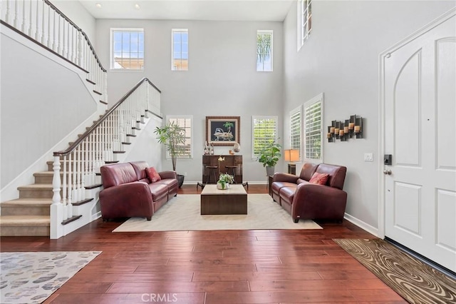 46379 Canyon Crest Ct, Temecula, CA 92592 - living room with a high ceiling, stairs, and hardwood / wood-style flooring