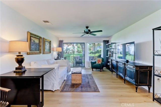 3205 Via Buena Unit B, Laguna Woods, CA 92637 - living room featuring a ceiling fan and light wood-style floors