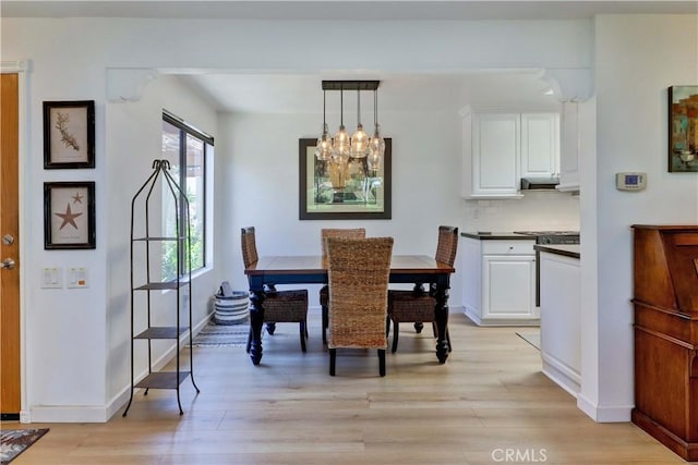 3205 Via Buena Unit B, Laguna Woods, CA 92637 - dining space featuring light wood-type flooring and a chandelier