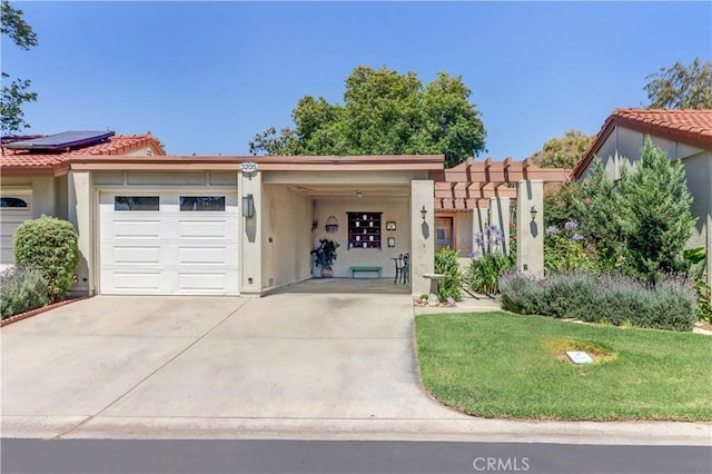 3205 Via Buena Unit B, Laguna Woods, CA 92637 - view of front facade with an attached garage, stucco siding, concrete driveway, a tiled roof, and a front lawn