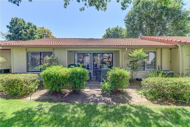 3205 Via Buena Unit B, Laguna Woods, CA 92637 - view of front facade with a tile roof, stucco siding, and a front lawn