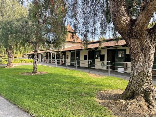 3205 Via Buena Unit B, Laguna Woods, CA 92637 - view of front facade with an exterior structure and a shingled roof