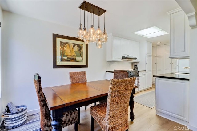 3205 Via Buena Unit B, Laguna Woods, CA 92637 - dining room with light wood-style flooring and a chandelier