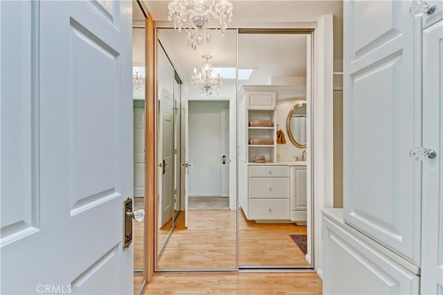 3205 Via Buena Unit B, Laguna Woods, CA 92637 - hall with a chandelier and light wood-type flooring