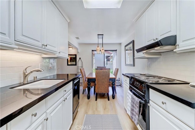 3205 Via Buena Unit B, Laguna Woods, CA 92637 - kitchen featuring range with electric cooktop, under cabinet range hood, dark countertops, and tasteful backsplash