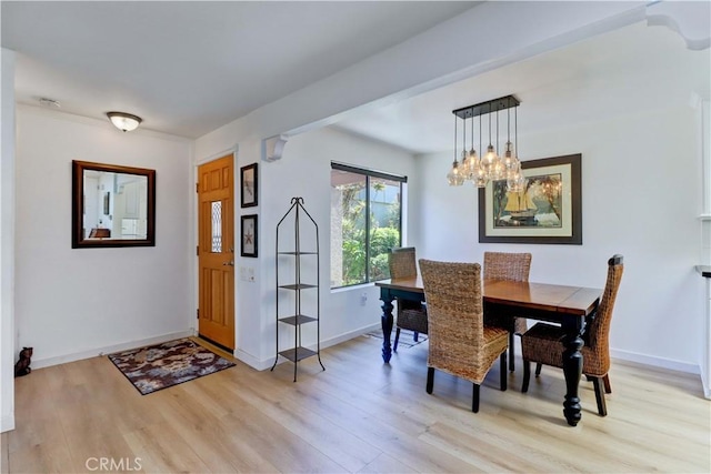3205 Via Buena Unit B, Laguna Woods, CA 92637 - dining area featuring light wood-type flooring and a chandelier