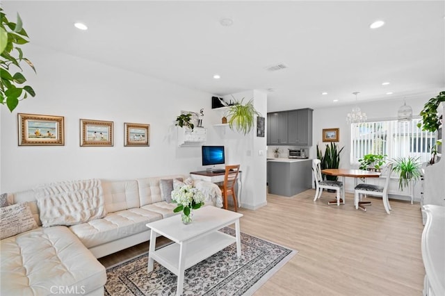 1722 Westcliff Dr Unit 11, Newport Beach, CA 92660 - living area featuring recessed lighting, light wood-type flooring, and a chandelier