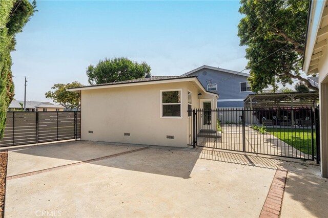 2721 184th St, Redondo Beach, CA 90278 - rear view of property with crawl space, a gate, and stucco siding