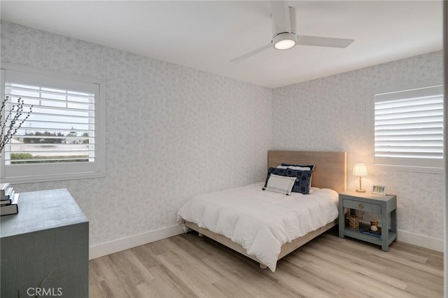 19125 Anza Ave, Torrance, CA 90503 - bedroom featuring light wood-style floors, wallpapered walls, and a ceiling fan