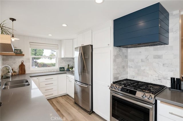 19125 Anza Ave, Torrance, CA 90503 - kitchen with stainless steel appliances, exhaust hood, backsplash, white cabinetry, and recessed lighting