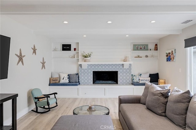 19125 Anza Ave, Torrance, CA 90503 - living room featuring wood finished floors, beamed ceiling, a fireplace, built in features, and recessed lighting