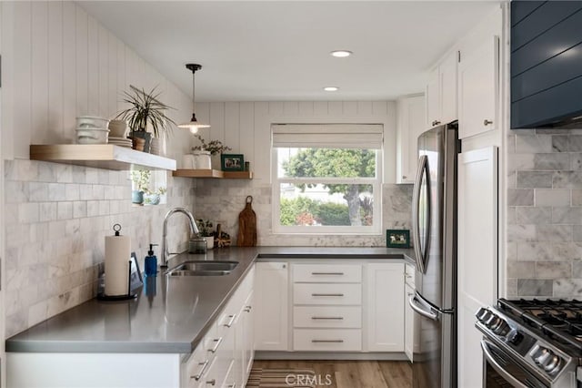 19125 Anza Ave, Torrance, CA 90503 - kitchen featuring stainless steel counters, open shelves, appliances with stainless steel finishes, white cabinetry, and backsplash
