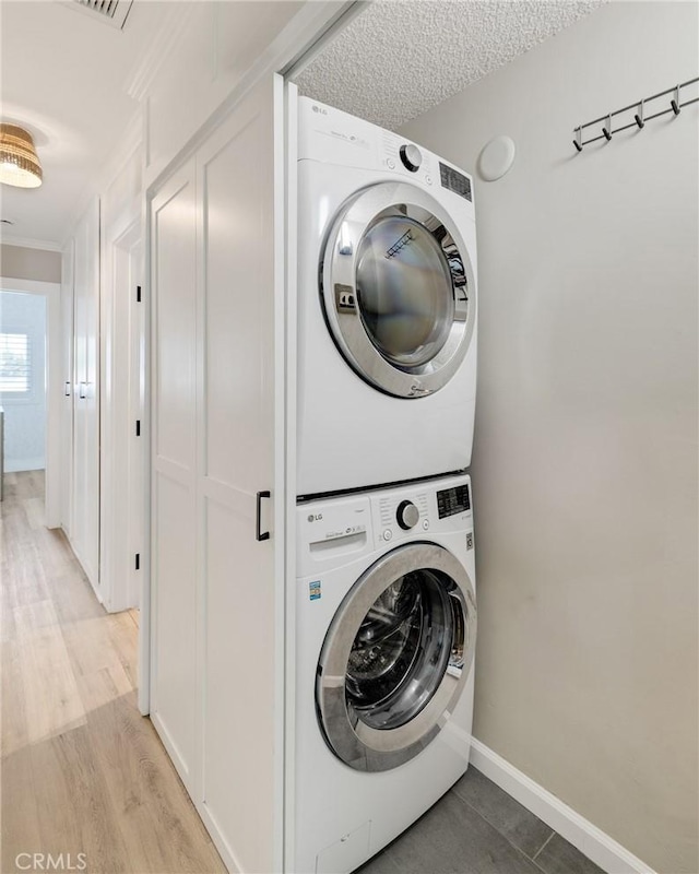 19125 Anza Ave, Torrance, CA 90503 - laundry room featuring stacked washer / dryer and light wood finished floors