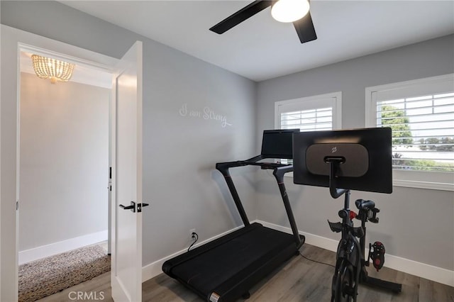 19125 Anza Ave, Torrance, CA 90503 - workout area with wood finished floors, ceiling fan, and a chandelier