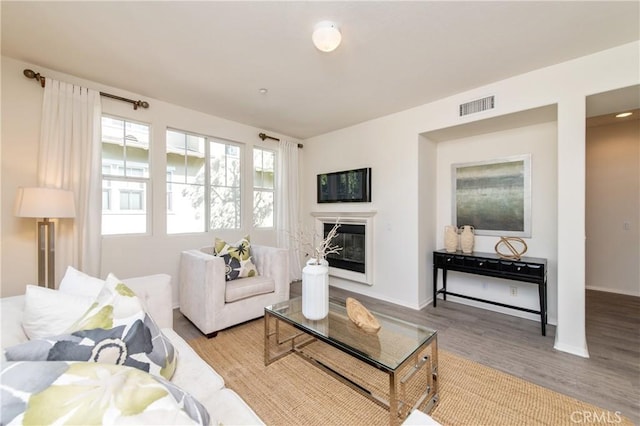 357 Flyers Ln, Tustin, CA 92782 - living area with wood finished floors and a glass covered fireplace