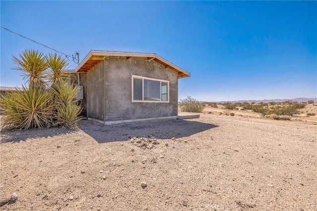 64515 Del Oro Rd, Joshua Tree, CA 92252 - view of property exterior with stucco siding