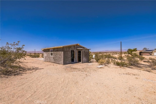 64515 Del Oro Rd, Joshua Tree, CA 92252 - back of property featuring an outbuilding