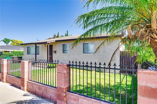 1510 E 53rd St, Long Beach, CA 90805 - view of front of property featuring stucco siding and a fenced front yard