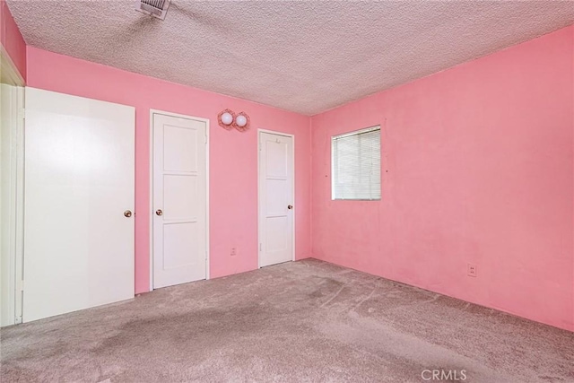 1510 E 53rd St, Long Beach, CA 90805 - unfurnished bedroom featuring carpet flooring and a textured ceiling