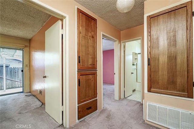 1510 E 53rd St, Long Beach, CA 90805 - corridor with light colored carpet and a textured ceiling