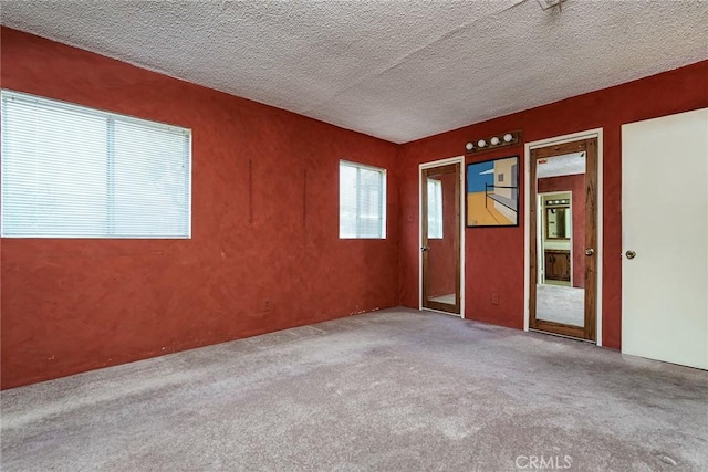1510 E 53rd St, Long Beach, CA 90805 - carpeted spare room with a textured ceiling