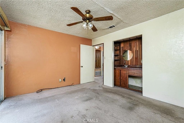 1510 E 53rd St, Long Beach, CA 90805 - unfurnished bedroom featuring carpet, a textured ceiling, and ceiling fan
