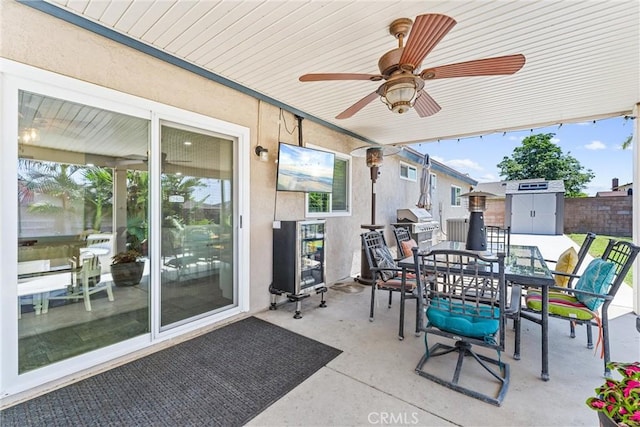 6057 Azalea St, Chino, CA 91710 - view of patio / terrace featuring a storage unit, outdoor dining space, ceiling fan, and grilling area