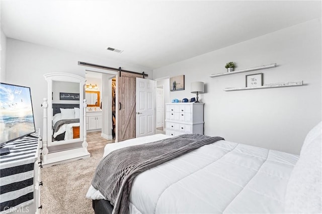 6057 Azalea St, Chino, CA 91710 - bedroom with a barn door, carpet floors, and ensuite bath