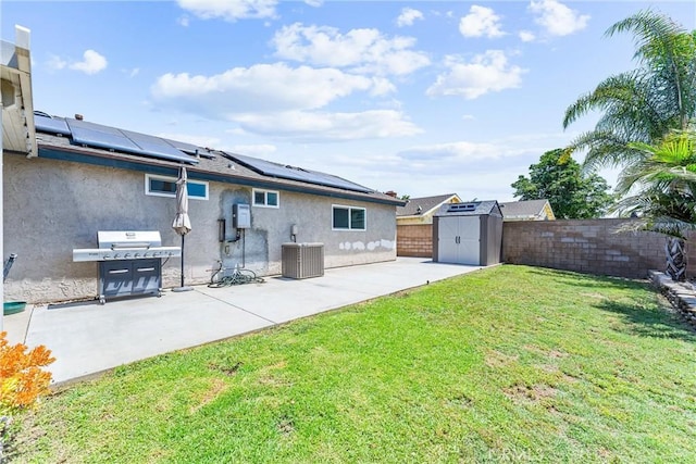 6057 Azalea St, Chino, CA 91710 - back of house with stucco siding, a shed, a patio area, roof mounted solar panels, and a fenced backyard
