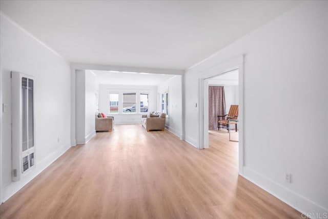 275 Euclid Ave, Long Beach, CA 90803 - hallway with light wood-style floors and a heating unit