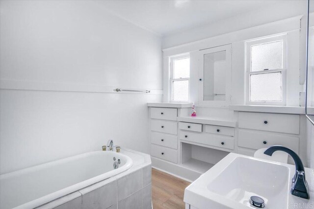 275 Euclid Ave, Long Beach, CA 90803 - bathroom featuring a bath and wood finished floors