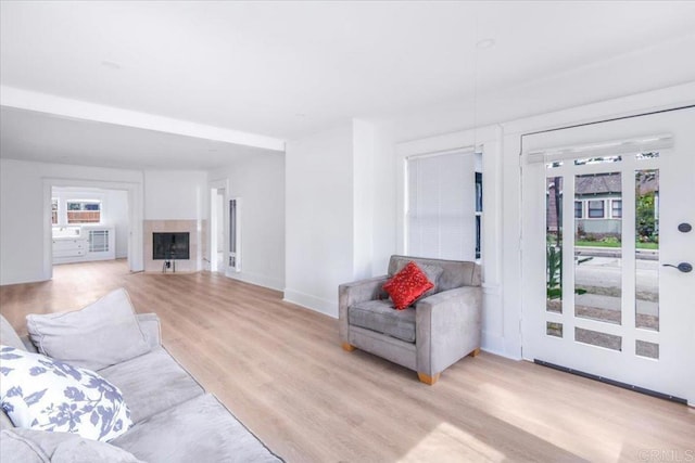 275 Euclid Ave, Long Beach, CA 90803 - living room with light wood finished floors and a fireplace